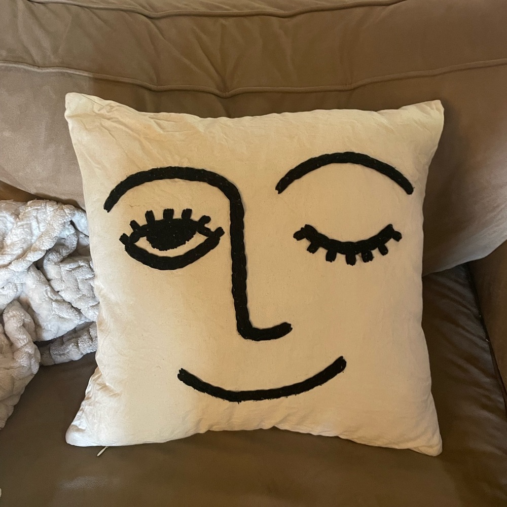 Iconic Urban Outfitters Winky Face Cream and Black Throw Pillow